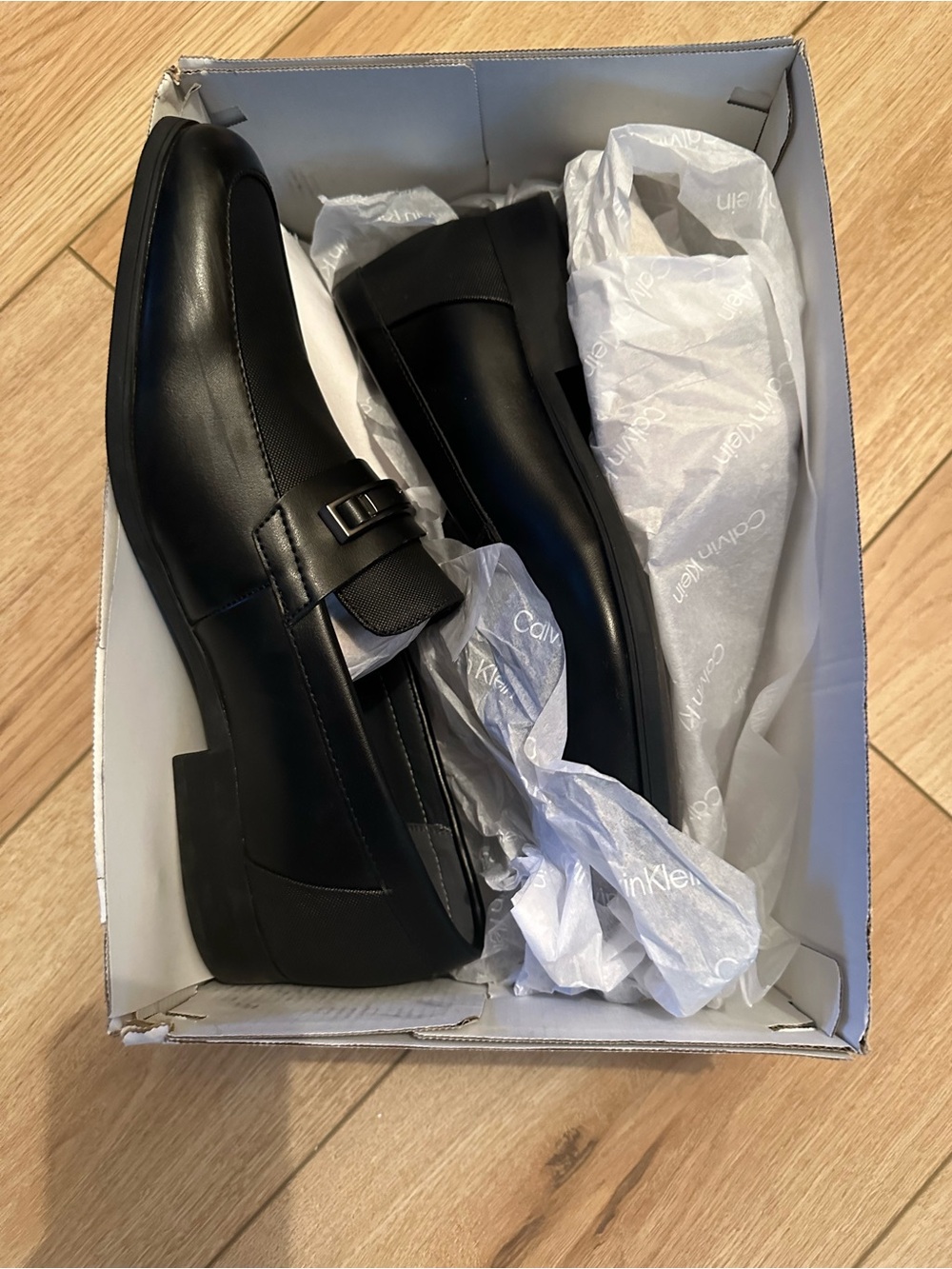 Calvin Klein Men's Black Leather Slip-On Loafers with Buckle Accent